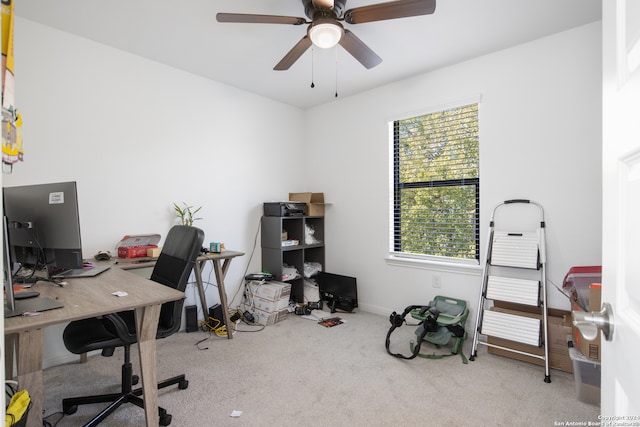 office space with ceiling fan and light colored carpet