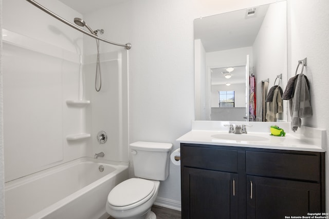 full bathroom featuring bathtub / shower combination, vanity, and toilet