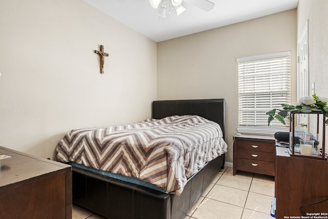 tiled bedroom with ceiling fan