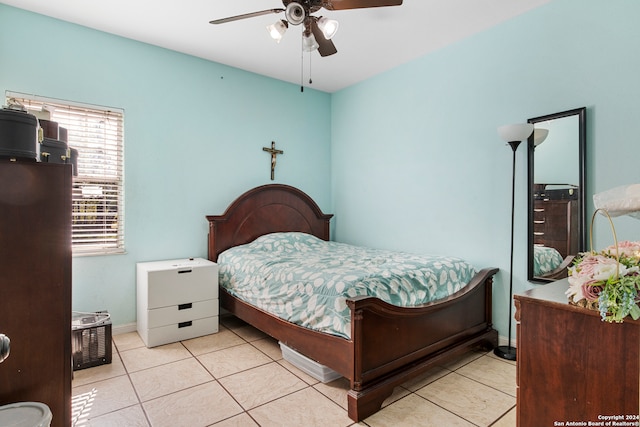 tiled bedroom with ceiling fan