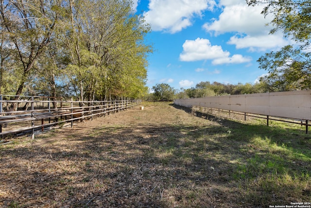 view of yard with a rural view