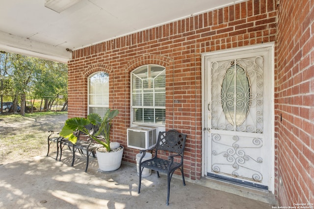 entrance to property featuring cooling unit