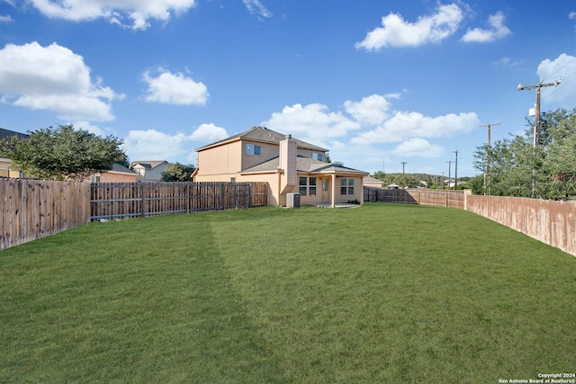 view of yard with central air condition unit