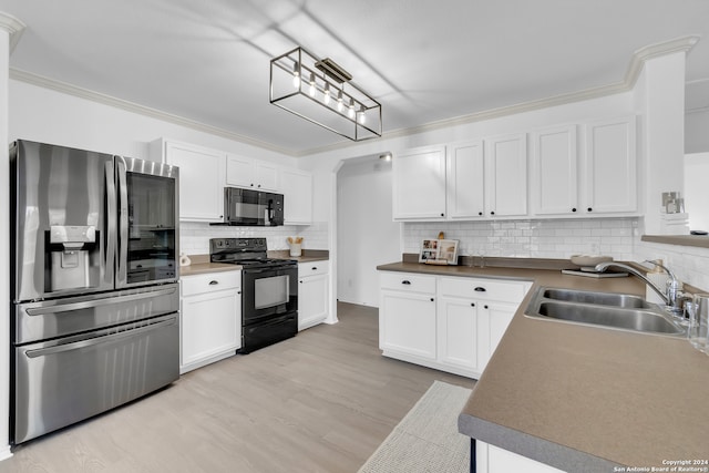 kitchen with black appliances, backsplash, white cabinets, and sink