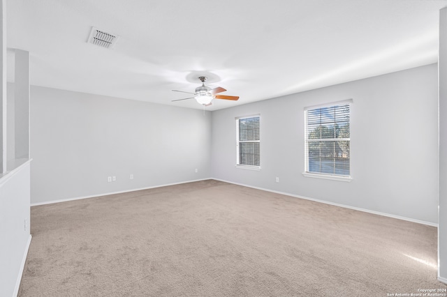 empty room with light carpet and ceiling fan