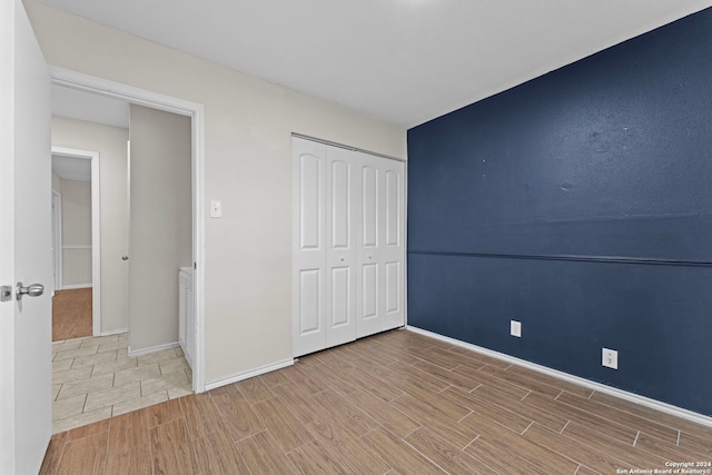 unfurnished bedroom with a closet