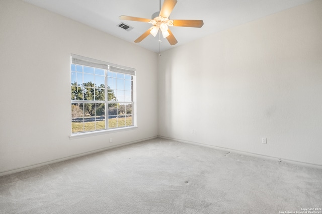 carpeted empty room with ceiling fan