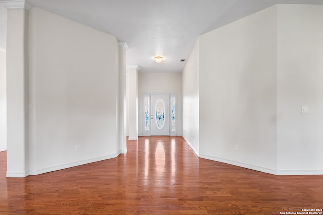 spare room with wood-type flooring