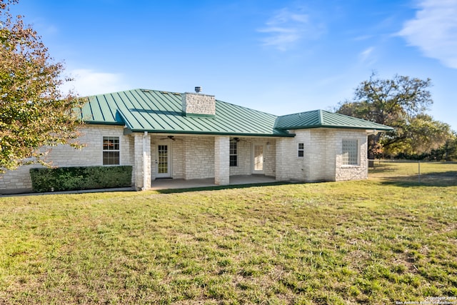 back of house with a yard, ceiling fan, and a patio area