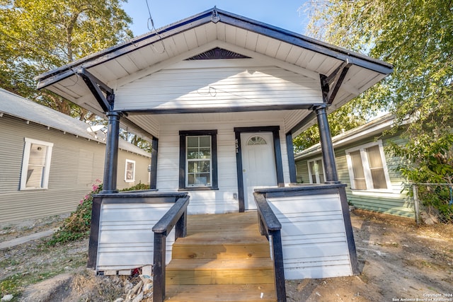 doorway to property featuring covered porch