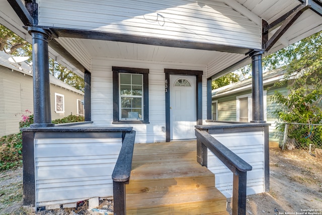 entrance to property featuring a porch