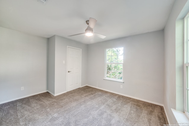 carpeted empty room with ceiling fan