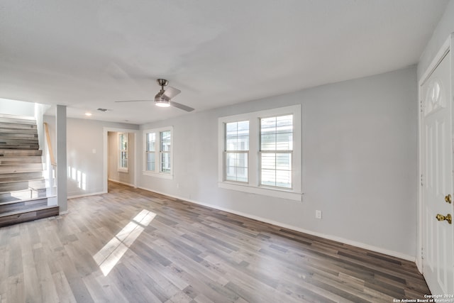 unfurnished living room with hardwood / wood-style floors and ceiling fan