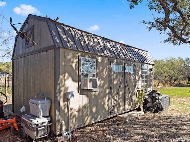 view of property exterior featuring an outbuilding