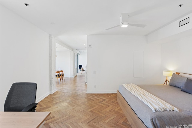 bedroom featuring ceiling fan and baseboards