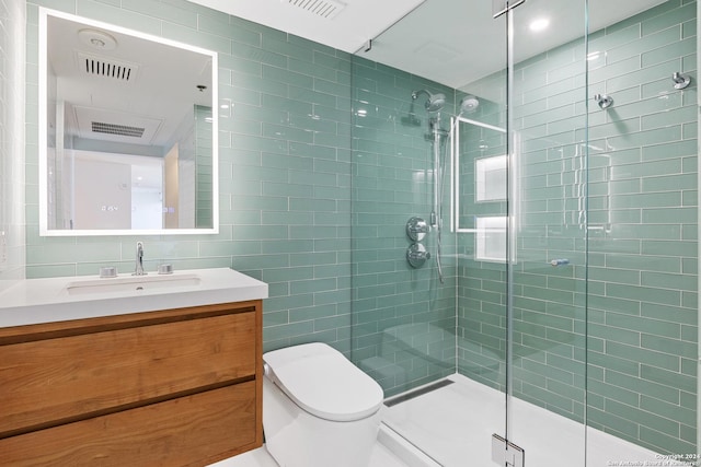 full bathroom featuring a stall shower, visible vents, tile walls, and vanity