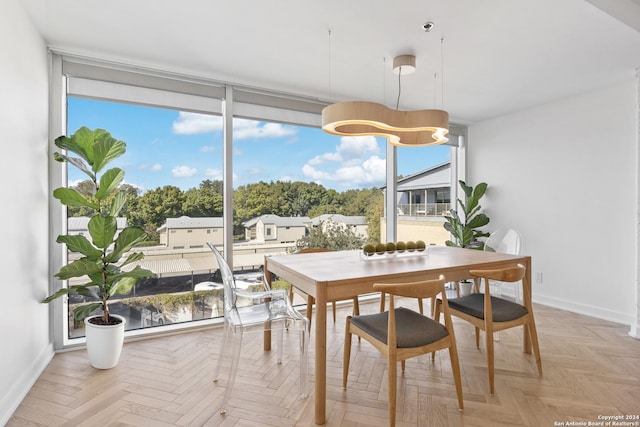 dining area featuring baseboards