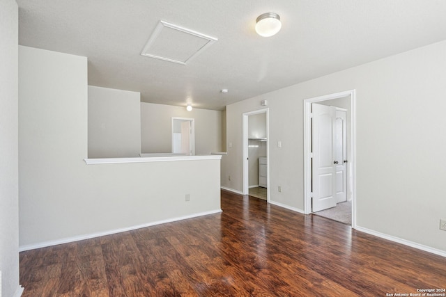 spare room featuring dark wood-type flooring