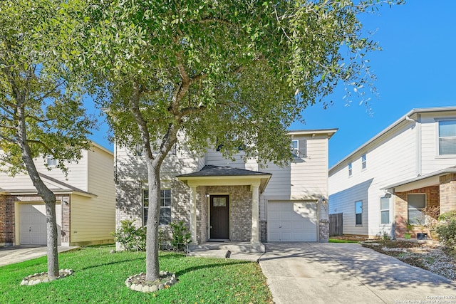 view of front of property with a garage and a front lawn