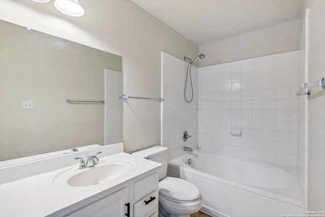 full bathroom with vanity, toilet, and tiled shower / bath