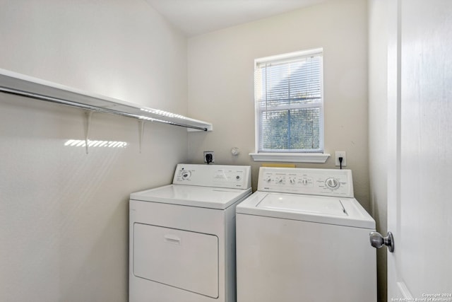 washroom with washer and dryer