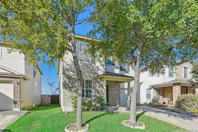 view of front of home with a garage and a front yard