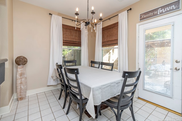 tiled dining room with a notable chandelier