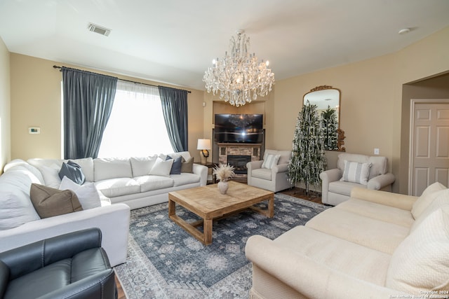 living room with hardwood / wood-style floors and a notable chandelier