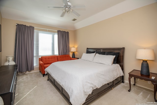 bedroom with light carpet and ceiling fan