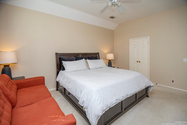 carpeted bedroom featuring ceiling fan and lofted ceiling