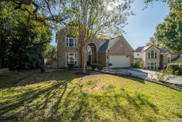 view of front of property with a front yard, solar panels, and a garage