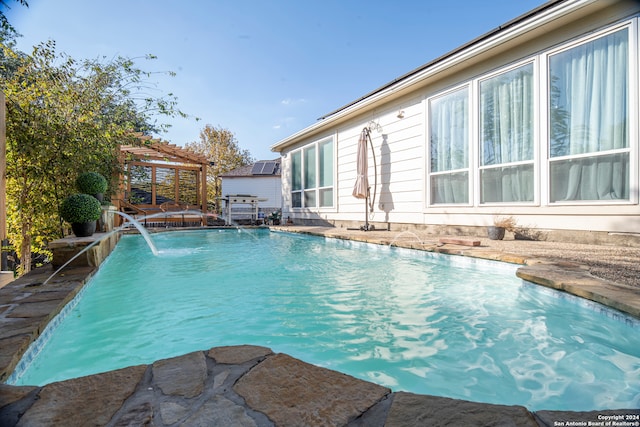 view of pool featuring pool water feature