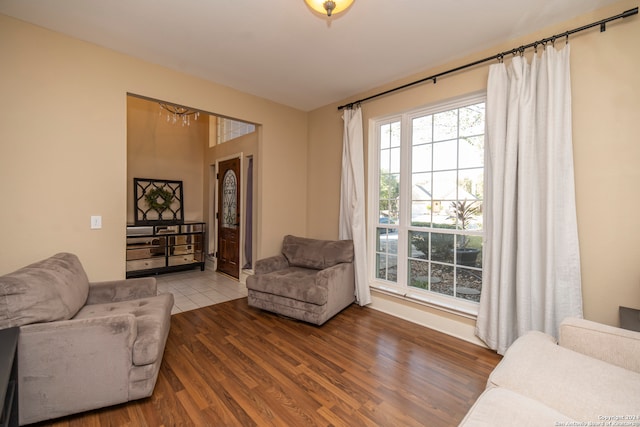 living room featuring hardwood / wood-style floors and a chandelier