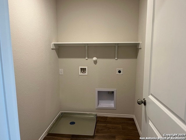 clothes washing area with hookup for an electric dryer, gas dryer hookup, dark hardwood / wood-style flooring, and hookup for a washing machine