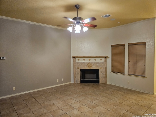 unfurnished living room featuring light tile patterned flooring, ceiling fan, crown molding, and a tiled fireplace