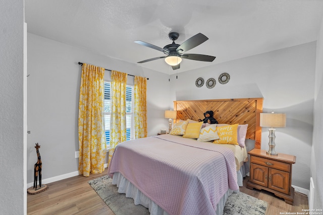 bedroom featuring ceiling fan and light wood-type flooring