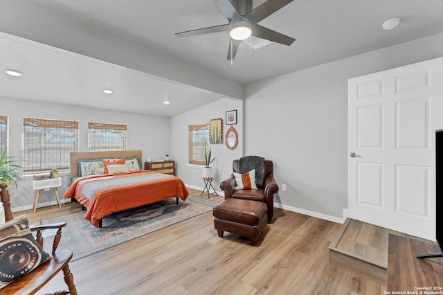 bedroom featuring vaulted ceiling, light hardwood / wood-style flooring, and ceiling fan