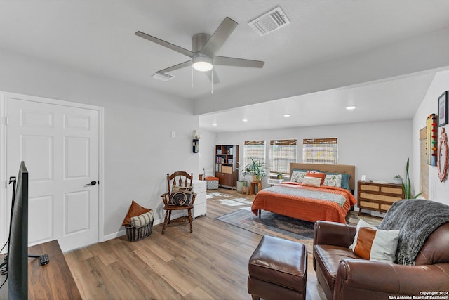 bedroom featuring ceiling fan and light hardwood / wood-style flooring