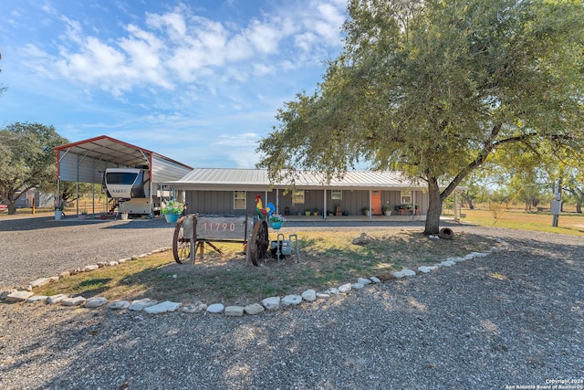 view of front of property featuring a carport