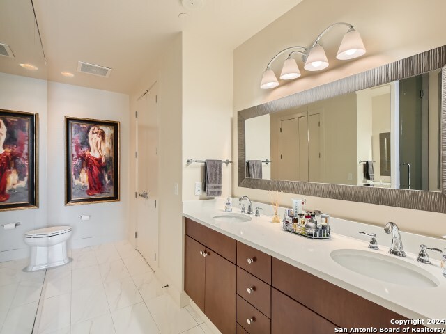 bathroom featuring vanity and toilet