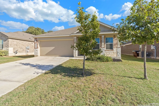 view of front of home with a garage and a front lawn