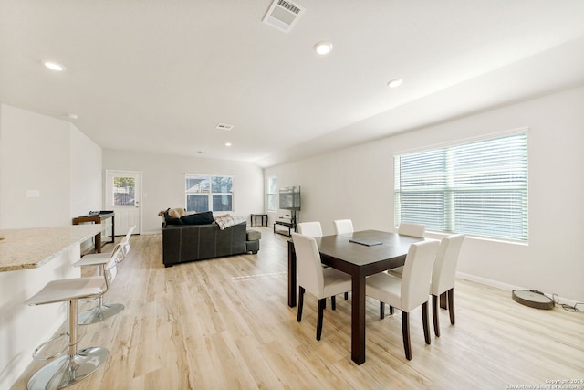 dining room featuring light hardwood / wood-style flooring and a healthy amount of sunlight