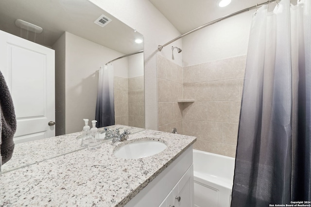 bathroom featuring shower / bath combo and sink