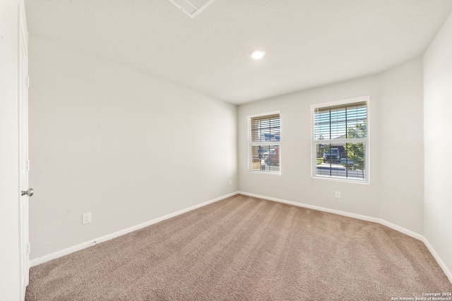 spare room featuring carpet floors