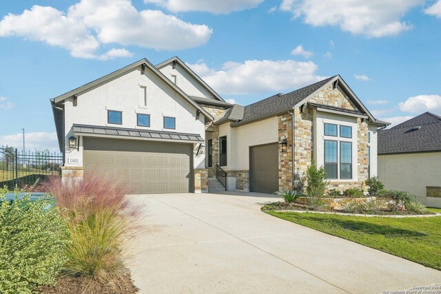 23422 Grande Vis, San Antonio, TX 78261 - view of front of property featuring stucco siding, driveway, stone siding, and fence
