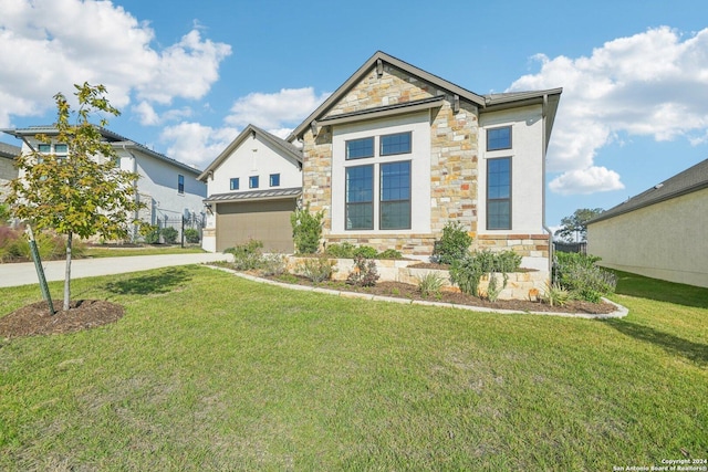 23422 Grande Vis, San Antonio, TX 78261 - view of front facade featuring stone siding, concrete driveway, an attached garage, a front lawn, and a standing seam roof