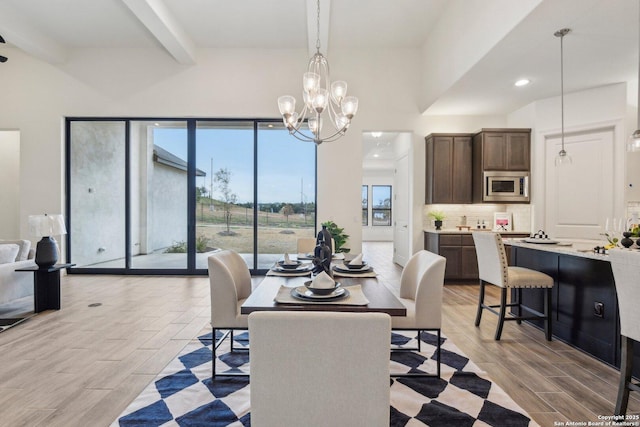 23422 Grande Vis, San Antonio, TX 78261 - dining room featuring beamed ceiling, light wood-style floors, a chandelier, recessed lighting, and a high ceiling