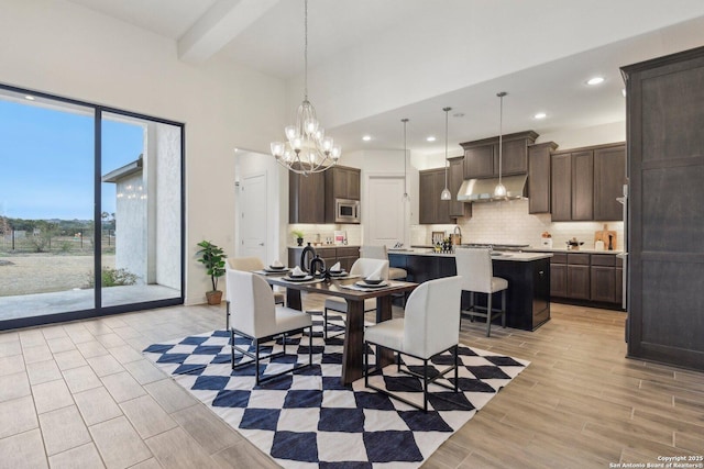 23422 Grande Vis, San Antonio, TX 78261 - dining space with a chandelier, recessed lighting, light wood-style flooring, a towering ceiling, and baseboards