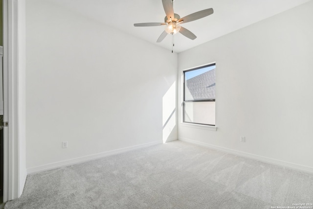 carpeted empty room with ceiling fan