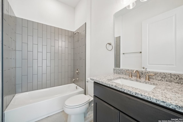 full bathroom with vanity, toilet, and tiled shower / bath combo